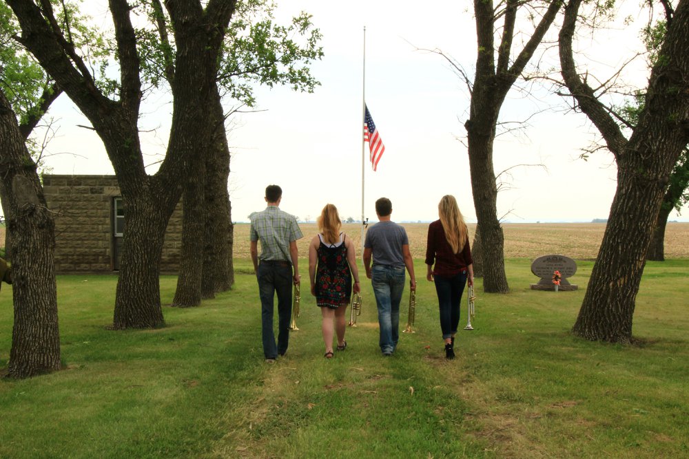 Buglers walking to half mast