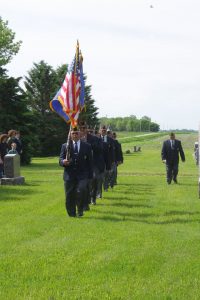 Detail marching led by US Flag